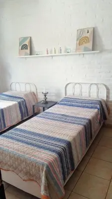 two beds sitting next to each other in a room at Duplex, Córdoba zona norte in Cordoba