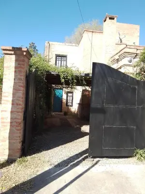 an entrance to a house with a black gate at Duplex, Córdoba zona norte in Cordoba