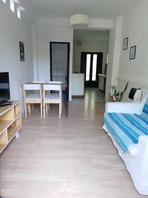 a living room with a table and a dining room at Duplex, Córdoba zona norte in Cordoba