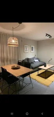 a living room with a table and a couch at Alquiler Temporal en Nueva Córdoba! in Cordoba