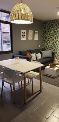 a living room with a table and a couch at Alquiler Temporal en Nueva Córdoba! in Cordoba
