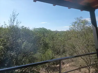 a view of the trees from the balcony of a house at Torito's House 2 in Tanti
