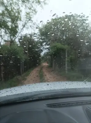 a view of a dirt road through a car window at Torito's House 2 in Tanti