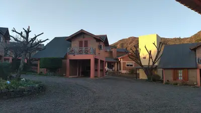 a group of houses on a gravel road at Cabañas Ruphay in Santa Rosa de Calamuchita