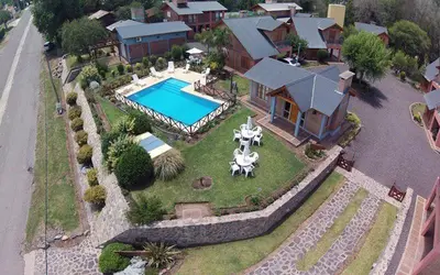 an aerial view of a house with a swimming pool at Cabañas Ruphay in Santa Rosa de Calamuchita