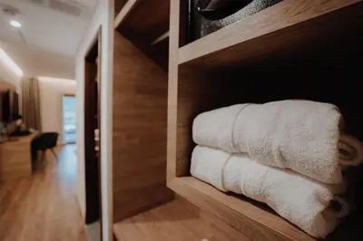 a bunch of towels are on a shelf at Böden Hotel & Spa, AKEN SOUL in Villa General Belgrano