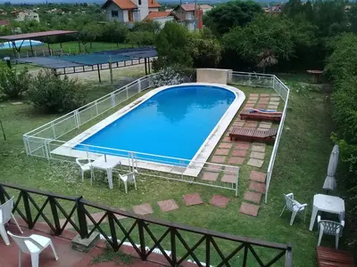 an overhead view of a swimming pool in a yard at Hotel posada barrancas del sol in Merlo
