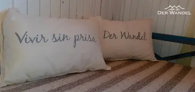 two pillows sitting on top of a bed at Der Wandel in Villa General Belgrano