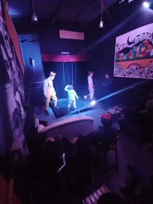 a group of people on a stage in a theatre at CASA ARTIGAS Hostel in Cordoba