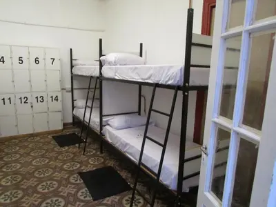 two bunk beds in a room with a window at CASA ARTIGAS Hostel in Cordoba