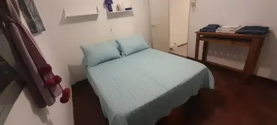a small bed in a small room with a table at hermoso Dpto. sobre La cañada en el centro de Córdoba capital-Argentina in Cordoba
