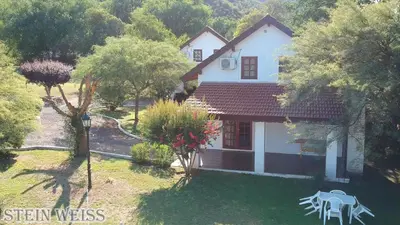 an aerial view of a house with a yard at Cabañas Stein Weiss in Santa Rosa de Calamuchita