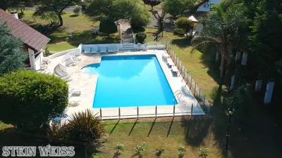 an overhead view of a swimming pool in a yard at Cabañas Stein Weiss in Santa Rosa de Calamuchita