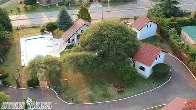 an overhead view of a house on an island with a statue at Cabañas Stein Weiss in Santa Rosa de Calamuchita