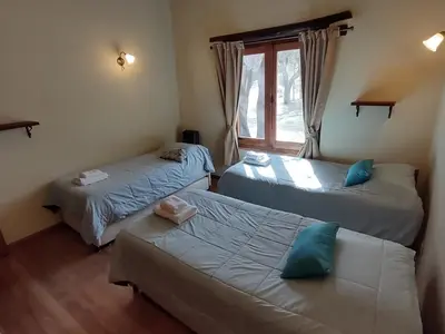 a bedroom with two beds and a window at La Morada, imperdible Casa de Campo en La Matilde in San Javier