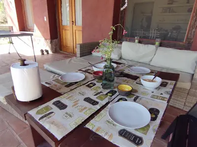 a living room with a table with plates on it at La Morada, imperdible Casa de Campo en La Matilde in San Javier