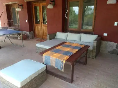 a patio with a couch and a table on a patio at La Morada, imperdible Casa de Campo en La Matilde in San Javier