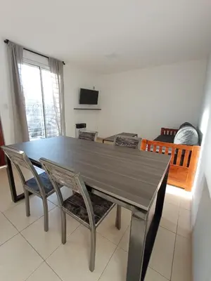 a dining room with a table and chairs at Descanso El Parque depto 420 in Cordoba