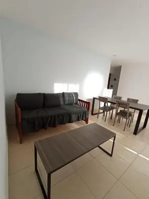 a living room with a couch and a table at Descanso El Parque depto 420 in Cordoba
