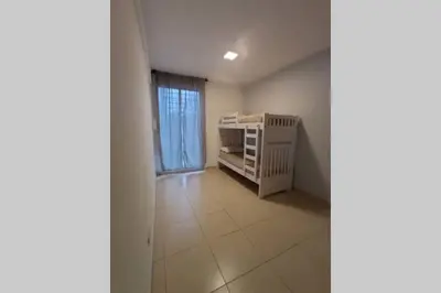 a small room with a crib in a room at Descanso El Parque depto 420 in Cordoba