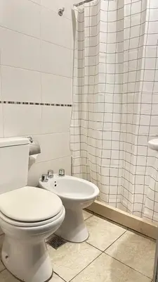 a bathroom with a toilet and a sink and a shower at Departamento Ecofriendly excelente ubicación in Cordoba