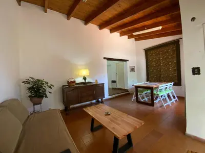 a living room with a couch and a table at condominio La Inesita in Villa Carlos Paz