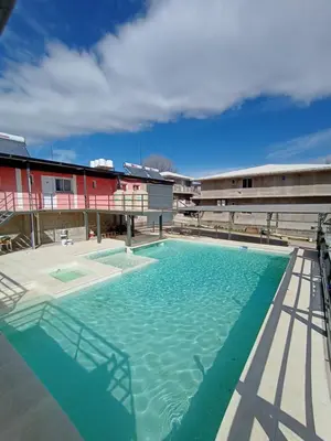 a large swimming pool on top of a building at La posta del vasco in Tanti