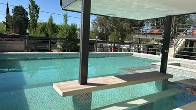 a large swimming pool with a clear blue at La posta del vasco in Tanti