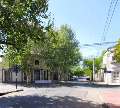 an empty street in a small town with trees at Dto Marian Dean funes 2515 Alto Alberdi in Cordoba