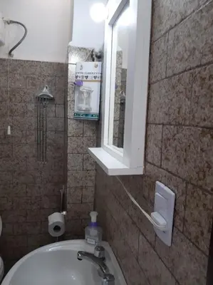 a bathroom with a sink and a mirror and a window at Dto Marian Dean funes 2515 Alto Alberdi in Cordoba