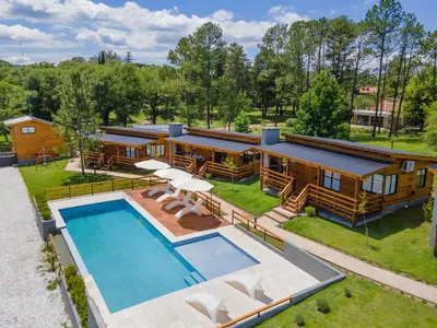 an aerial view of a house with a swimming pool at Monviso - Casas de montaña in Santa Rosa de Calamuchita