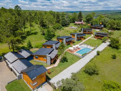 an aerial view of a home with a swimming pool at Monviso - Casas de montaña in Santa Rosa de Calamuchita
