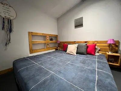 a bedroom with a large bed in a room at Abuelito dime tu in Mina Clavero
