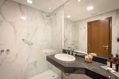 a bathroom with a sink and a shower at MAE Singular Hotel in Cordoba