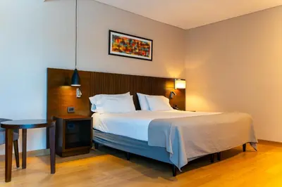 a hotel room with a bed and a table at MAE Singular Hotel in Cordoba
