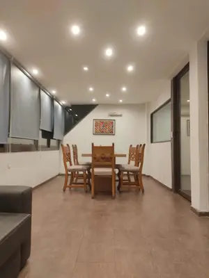 a dining room with a table and chairs at Piso Completo en Nueva Córdoba in Cordoba