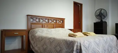 a bedroom with a bed with two towels on it at Piso Completo en Nueva Córdoba in Cordoba