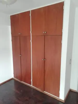 a row of wooden cabinets in a room at Illía Residential Apartament in Cordoba