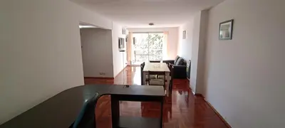 a living room with a table and a dining room at Illía Residential Apartament in Cordoba