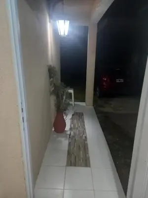 a hallway with a table and a potted plant at MIRADOR DEL LAGO - La Vista in Villa Parque Siquiman