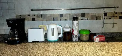 a group of appliances on a counter in a kitchen at Victorino House en el Cerro de las Rosas con cochera in Cordoba