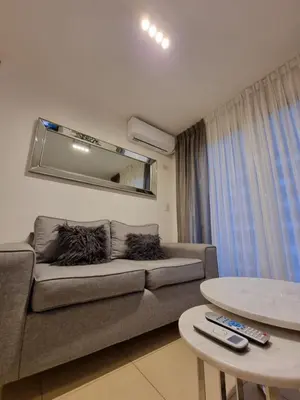a living room with a couch and a table at Nueva Córdoba - Premium in Cordoba