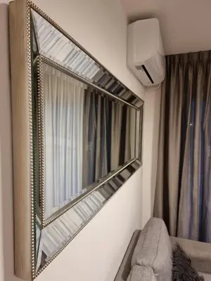 a mirror hanging on a wall in a room at Nueva Córdoba - Premium in Cordoba