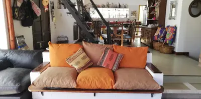 a couch with pillows on it in a room at La Ecle in San Javier