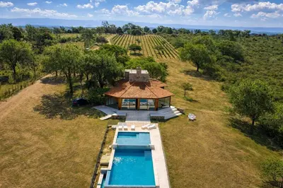 an aerial view of a house with a swimming pool at CABAÑA MAR - FINCA PUDUAM in Villa General Belgrano