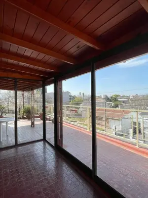a room with large windows with a view of a street at terrazas del Tajamar in Alta Gracia