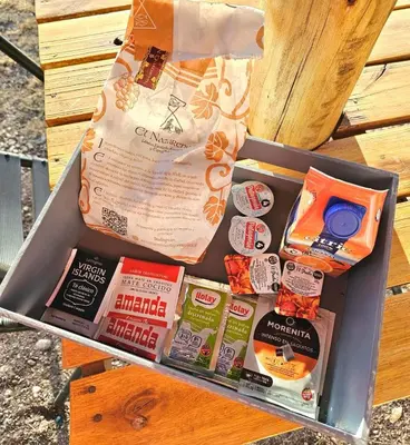a box filled with different types of food at Los Molles Suites -Solo 2 Pax- in Mina Clavero