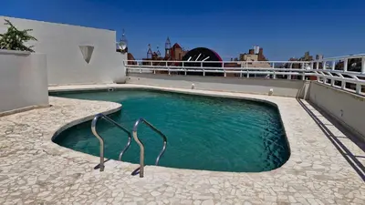 a swimming pool on the roof of a house at Amérian Córdoba in Cordoba