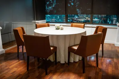 a white table and chairs in a room at Amérian Córdoba in Cordoba