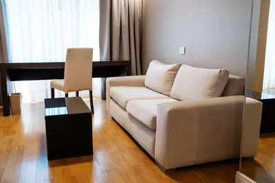 a living room with a couch and a table at Amérian Córdoba in Cordoba